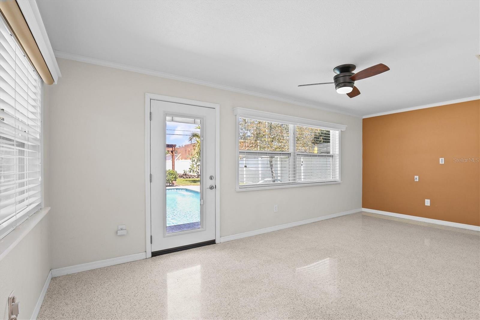 Spacious primary bedroom with abundant natural light