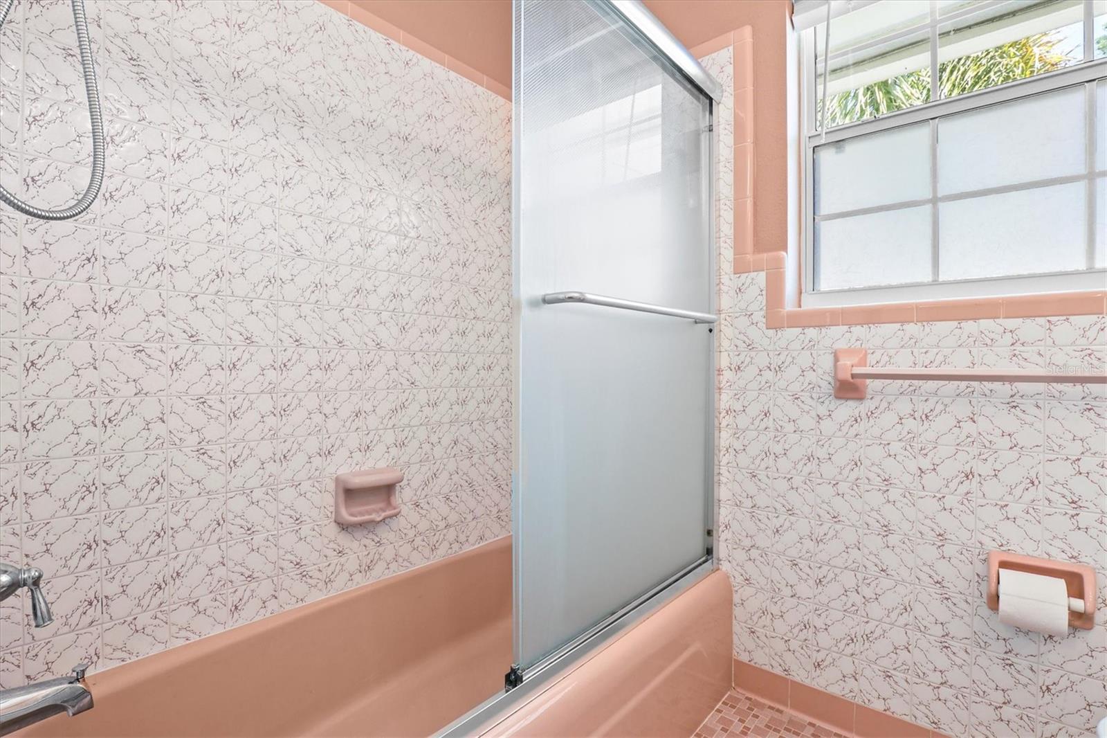 Second bathroom with granite countertop and white shaker cabinetry