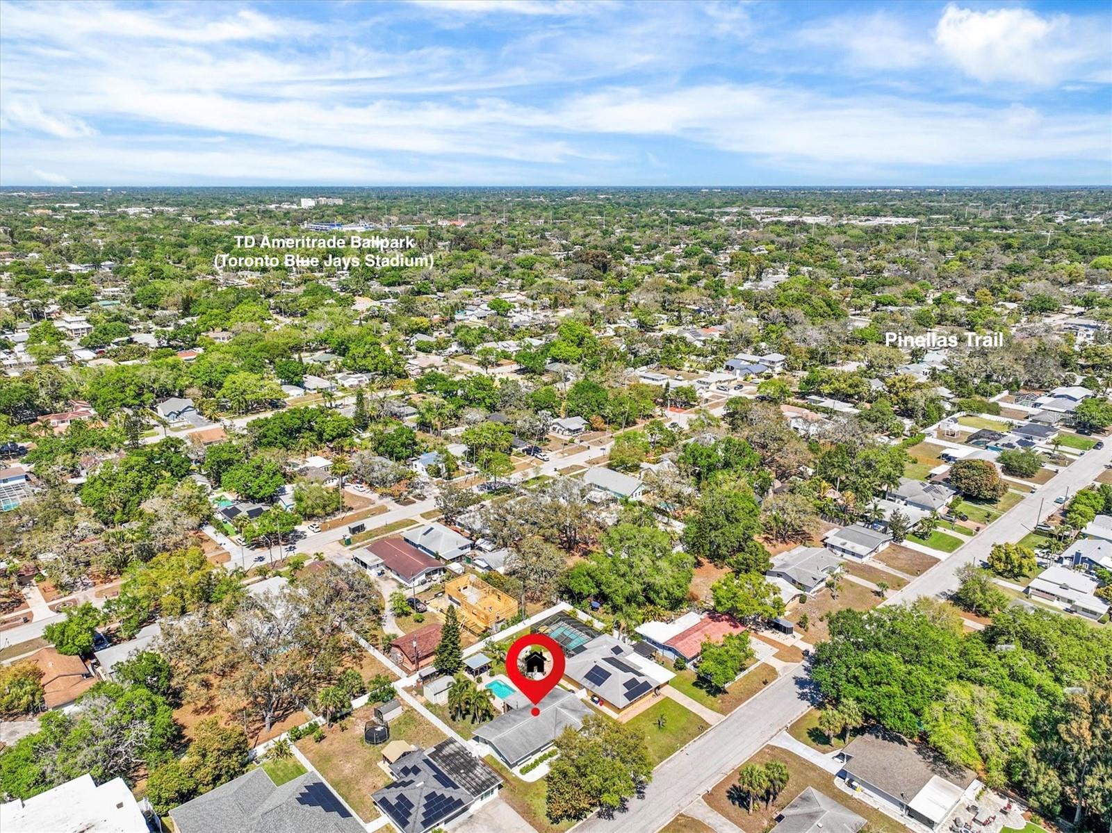 Aerial view showcasing prime location just moments from the water, the Pinellas Trail, TD Ameritrade Ballpark, and Downtown Dunedin.