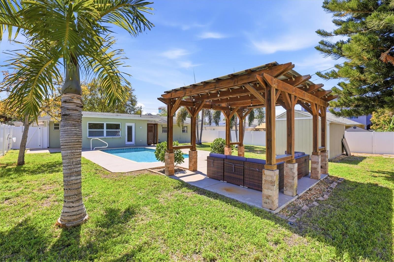 Covered lanai perfect for outdoor dining and relaxing year-round