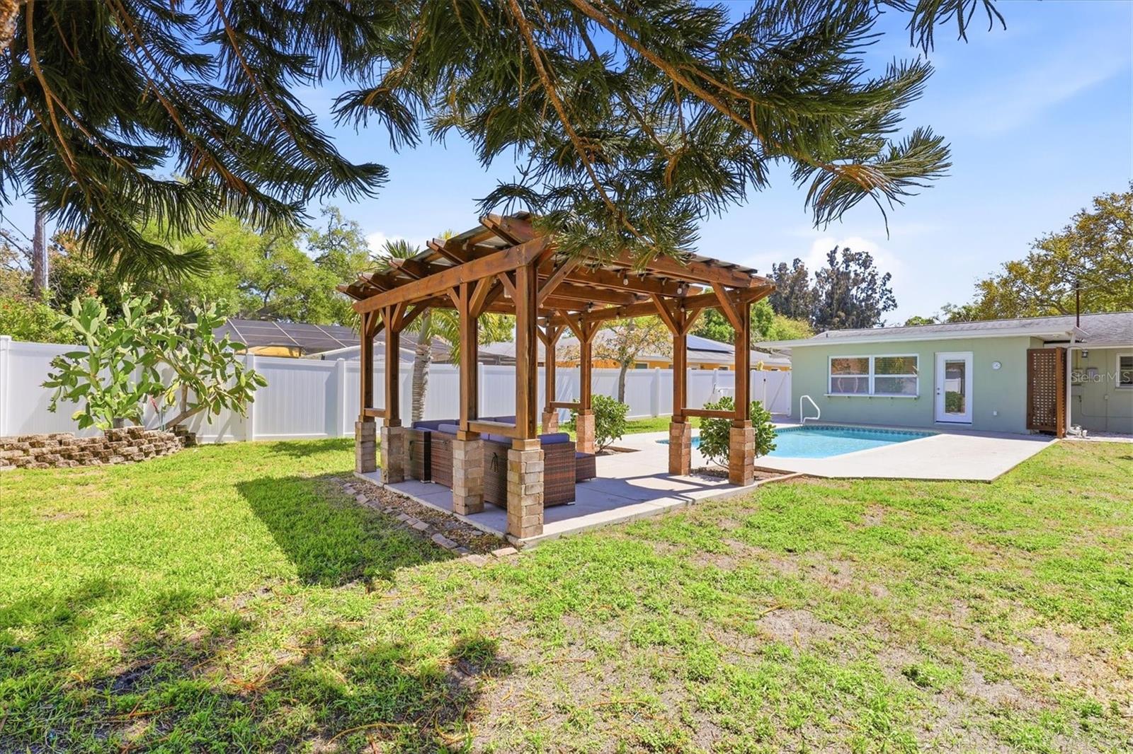 Covered lanai perfect for outdoor dining and relaxing year-round