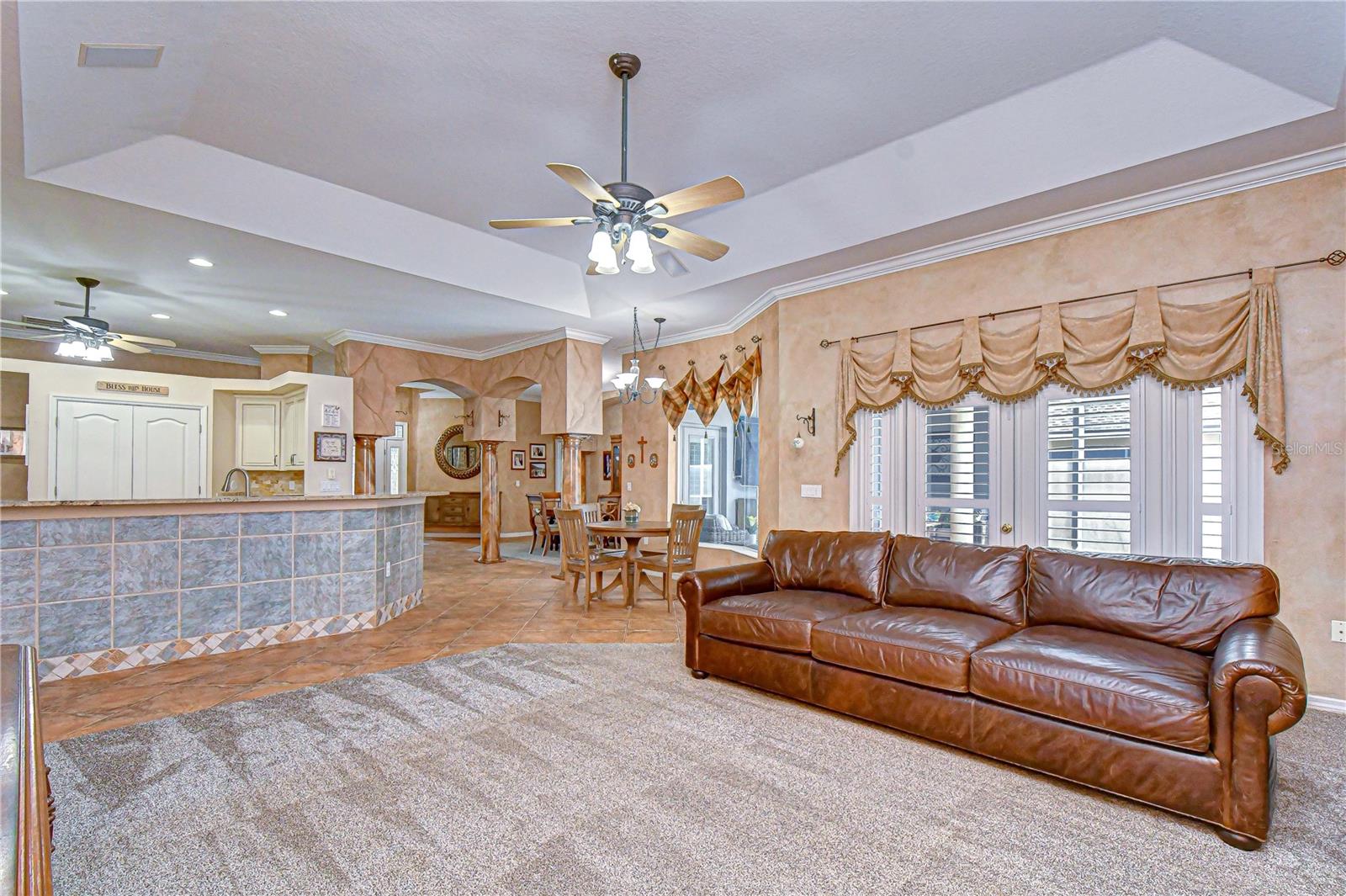 Crown molding and plantation shutters throughout main areas.