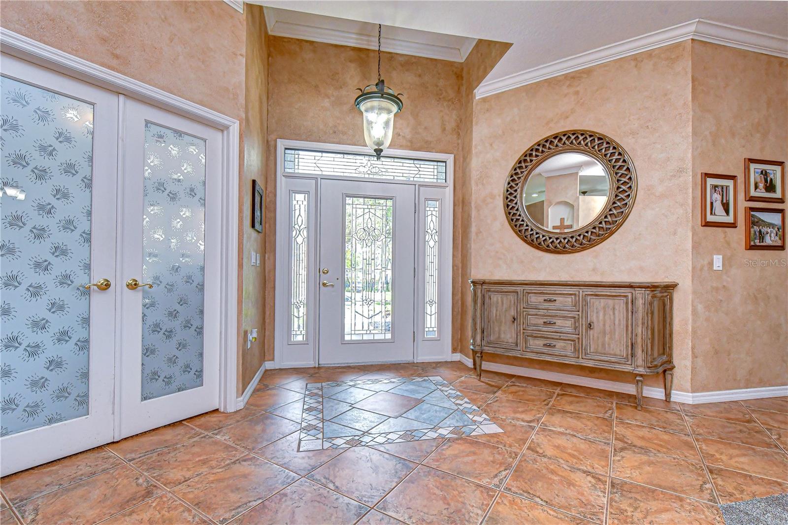 Bright and inviting foyer with elegant finishes.