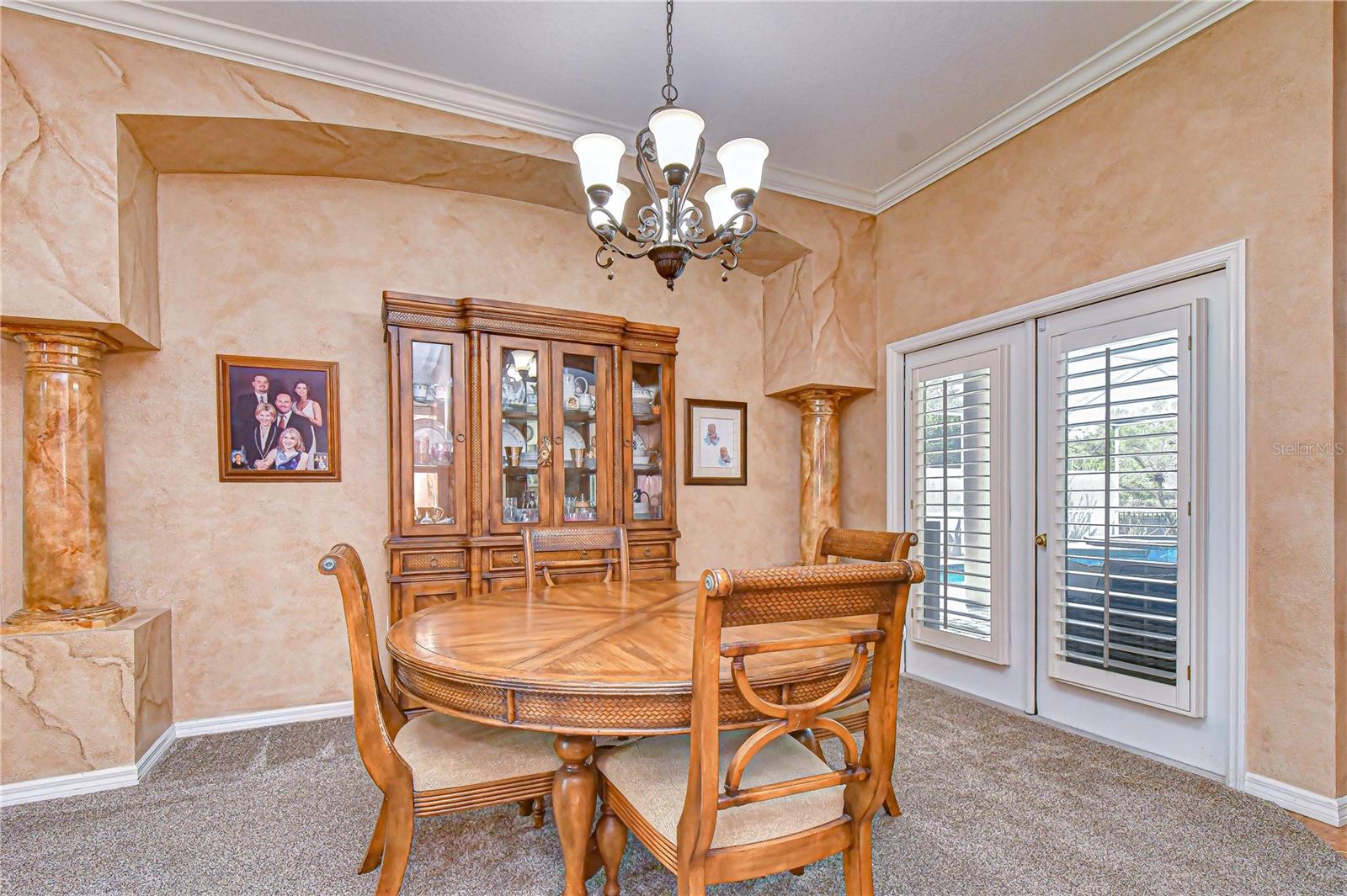Elegant dining space accented with architectural columns.