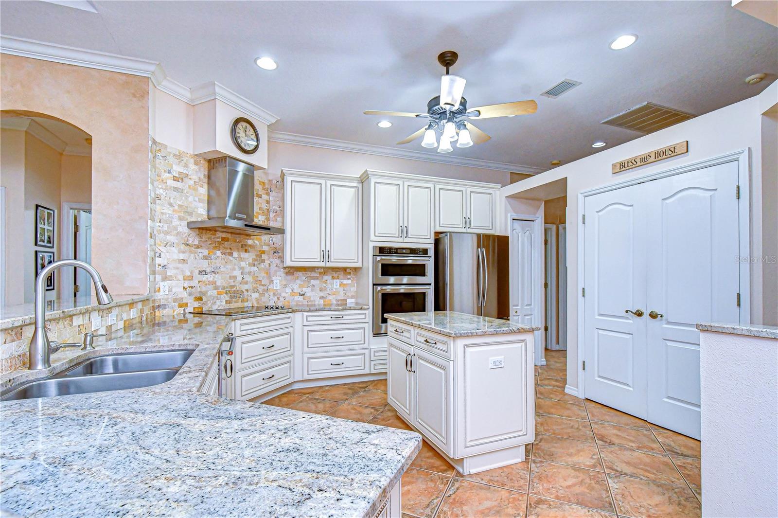 42” white cabinets with pull-out shelving for convenience.