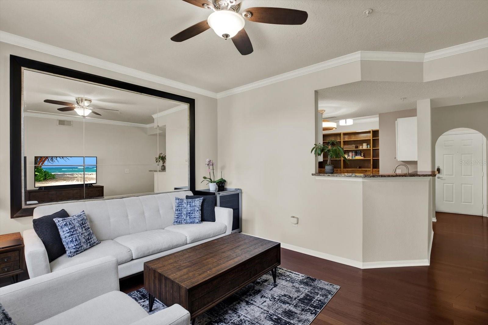 Living room overlooking entryway and kitchen