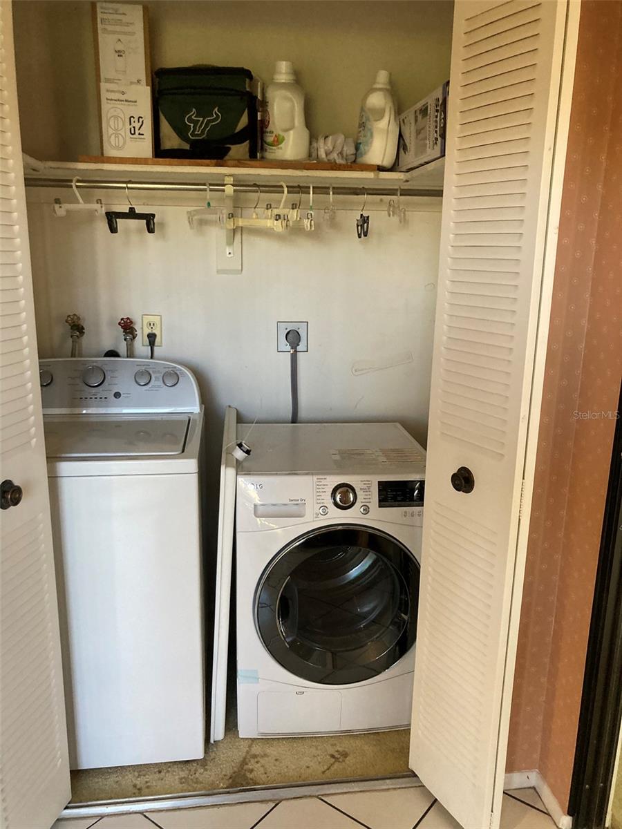 Full size washer and dryer just off the kitchen