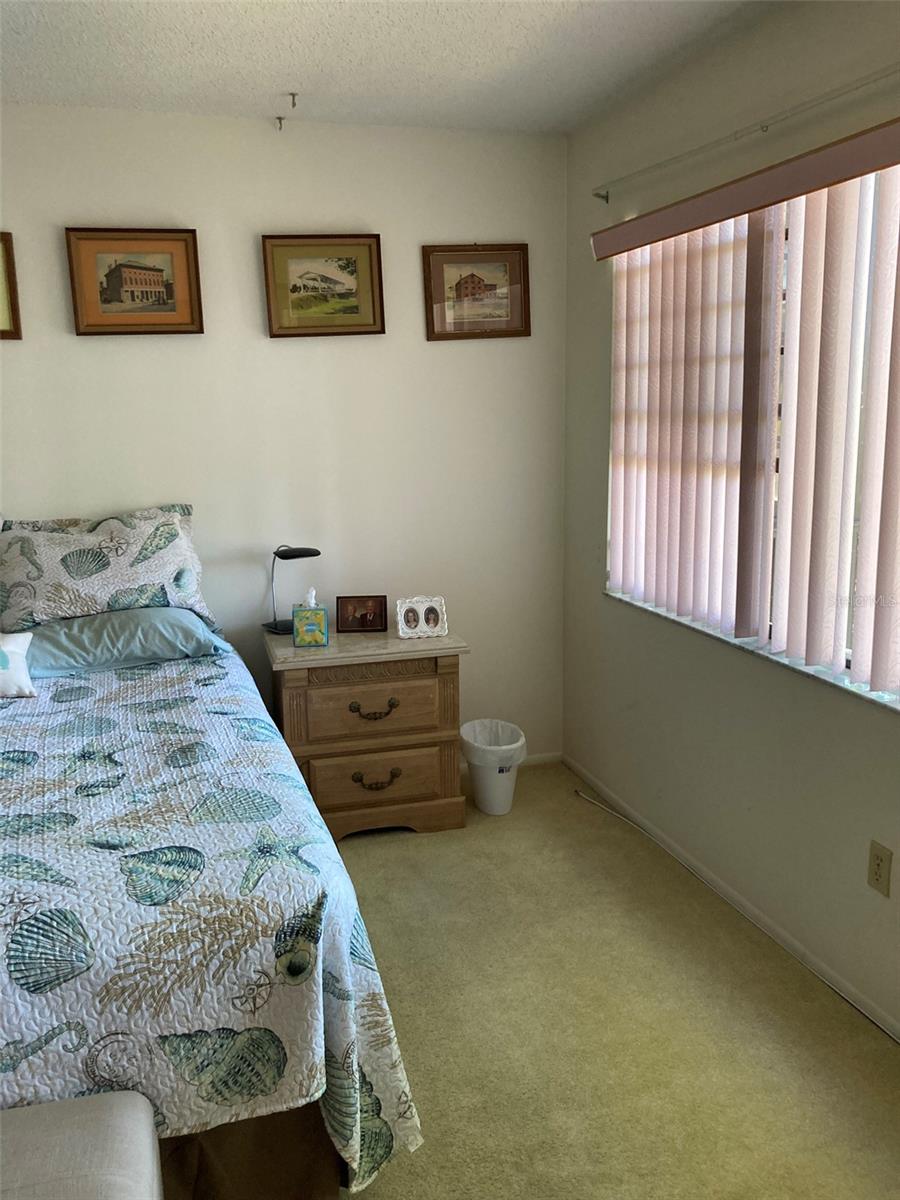 Master bedroom looks out over the pond