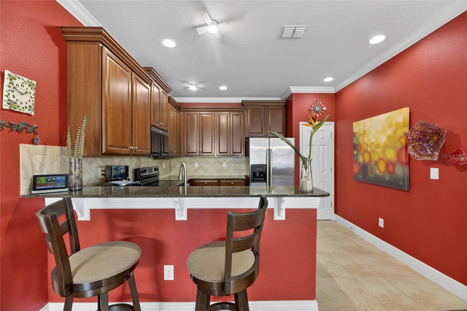 The kitchen is on the left as you walk further into the home.