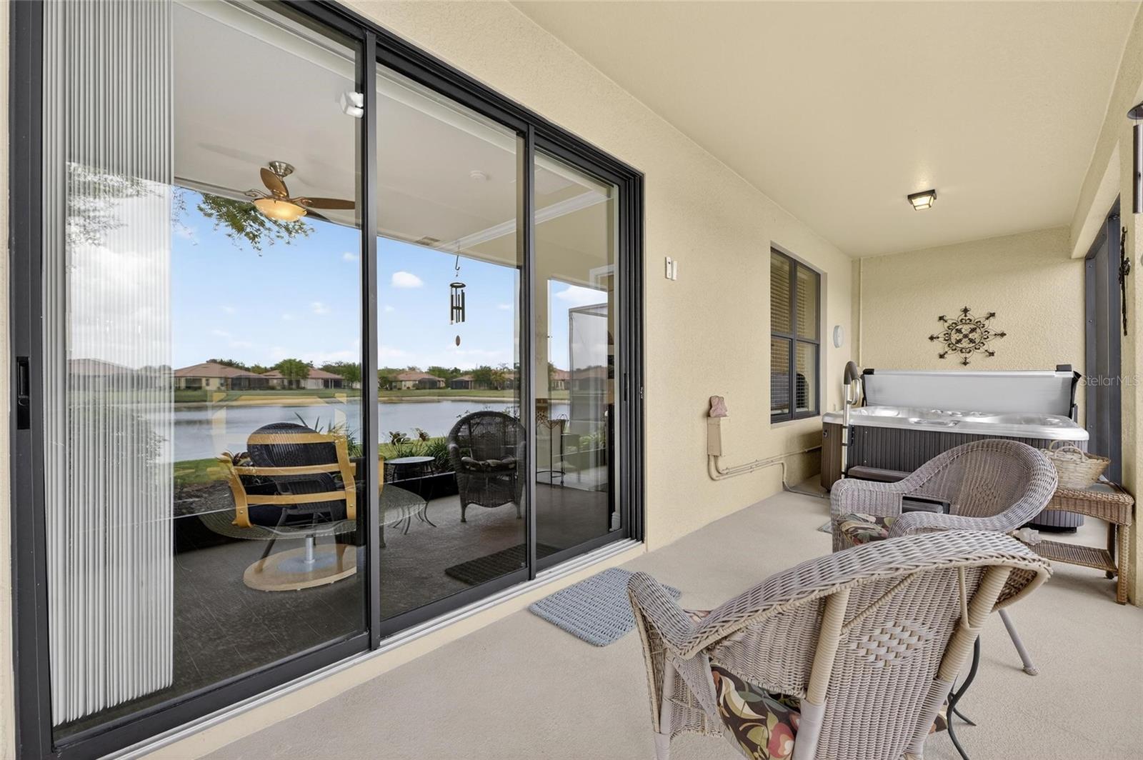 Sliders to the lanai with hot tub.