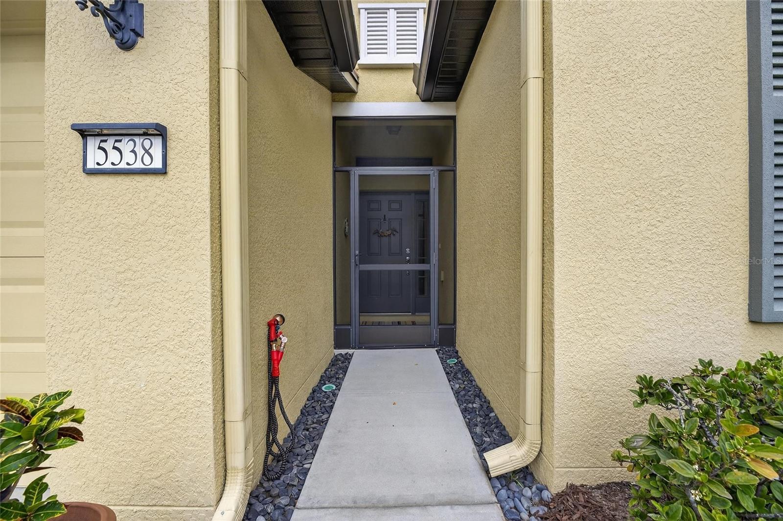 Screened in front entrance way.