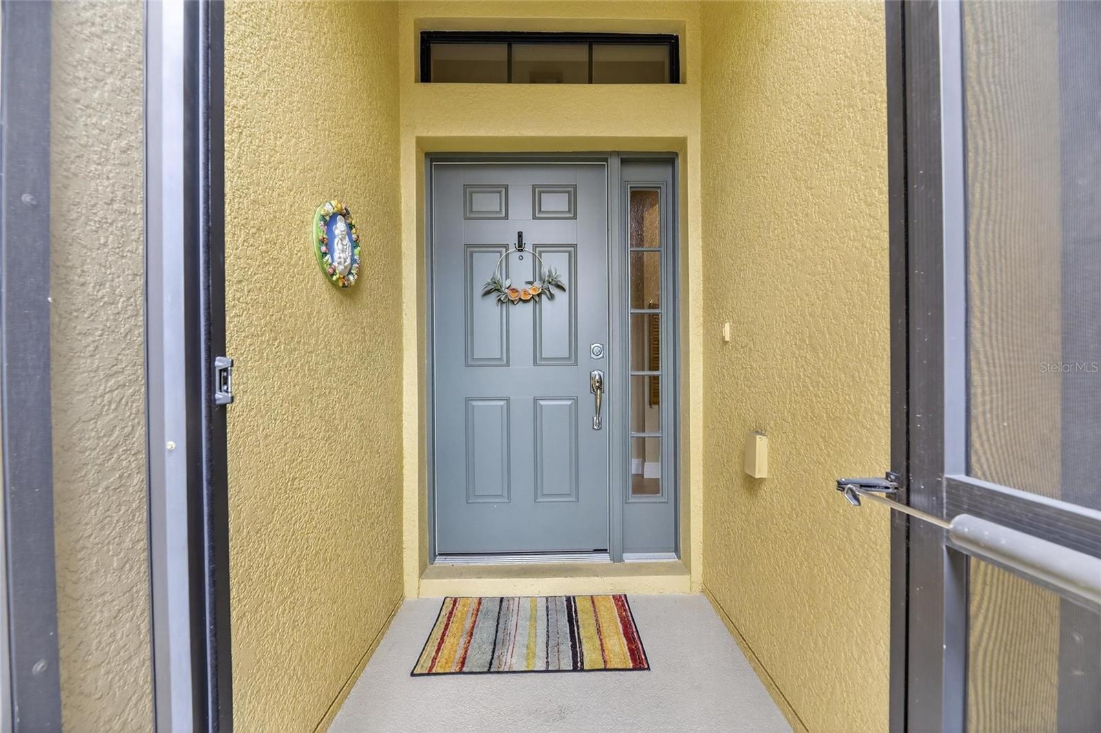 Front door with aide panel window.