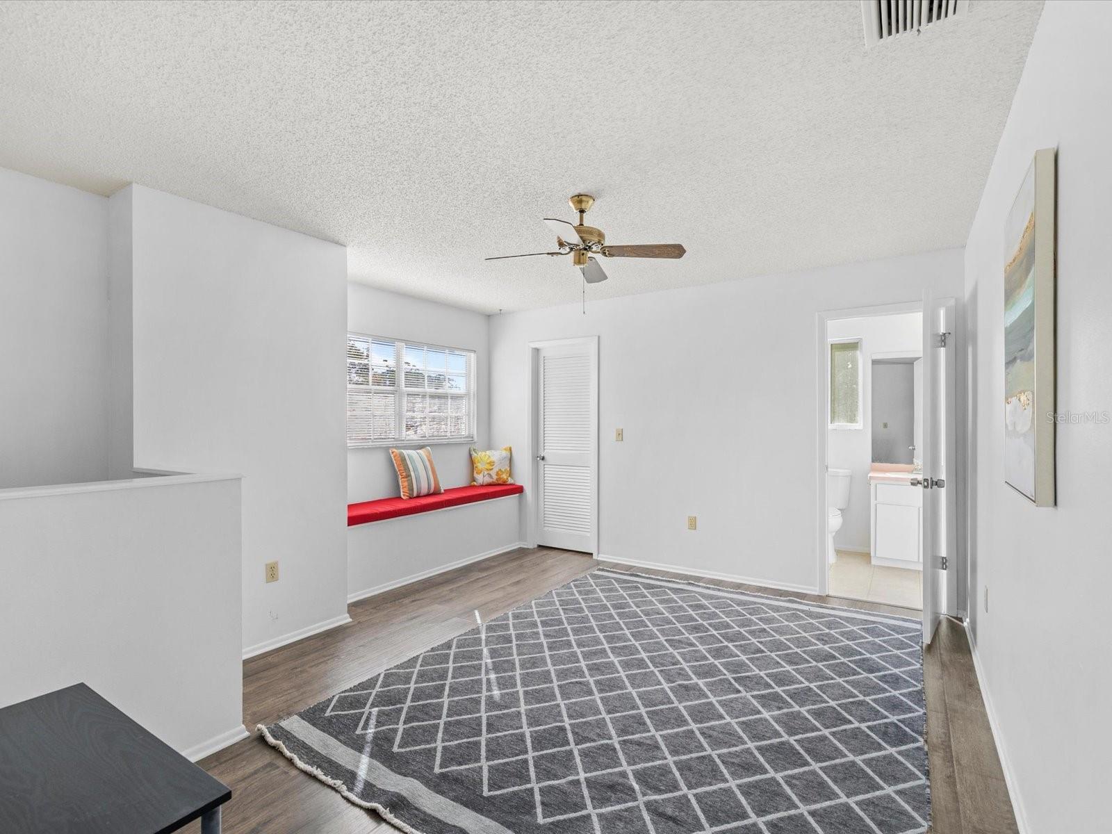 The Primary second bedroom is oversized and includes a sitting area, making it ideal for use as a second living room, home office, or hobby space