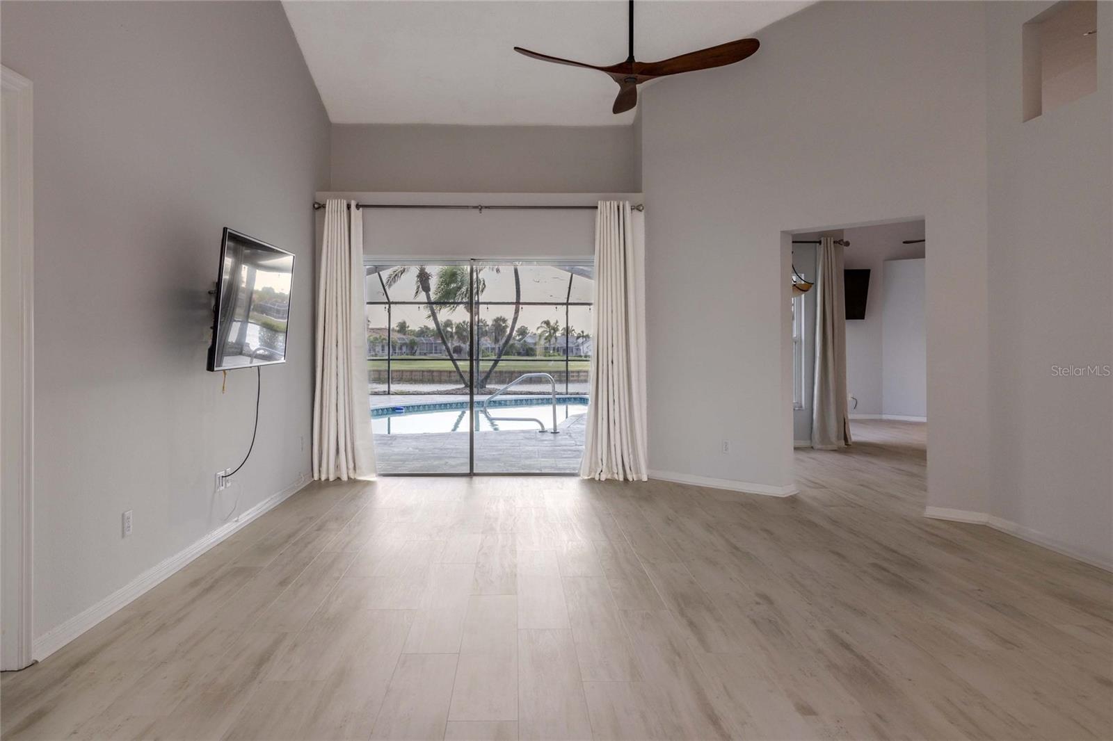 Living Room with Access to Primary Bedroom, Dinette, Kitchen, Family Room from Entry