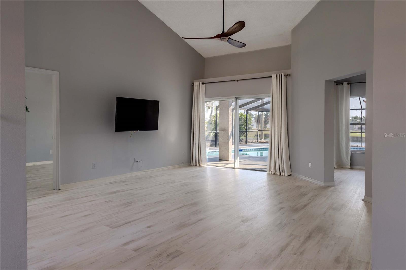 Living Room, Lanai and Pool View from Dining Room