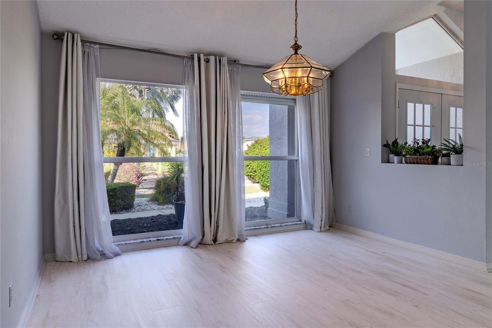 Dining Room with Vaulted Ceiling, Open to Entry
