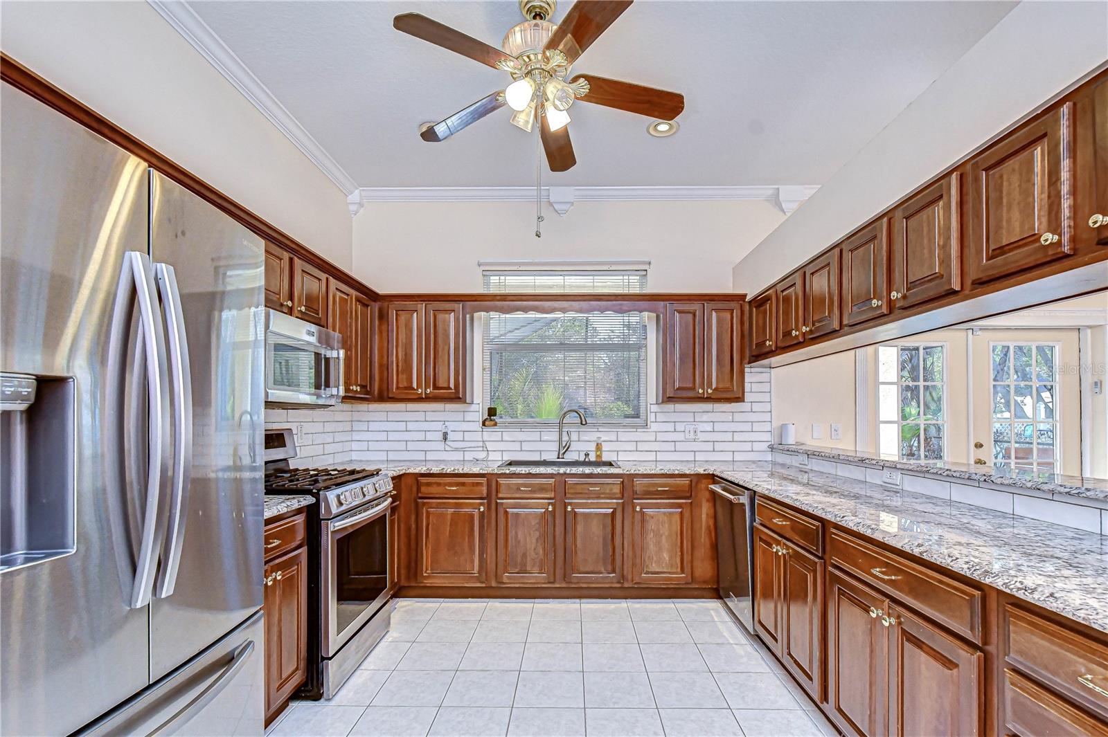 Stainless appliances and subway tile accents.