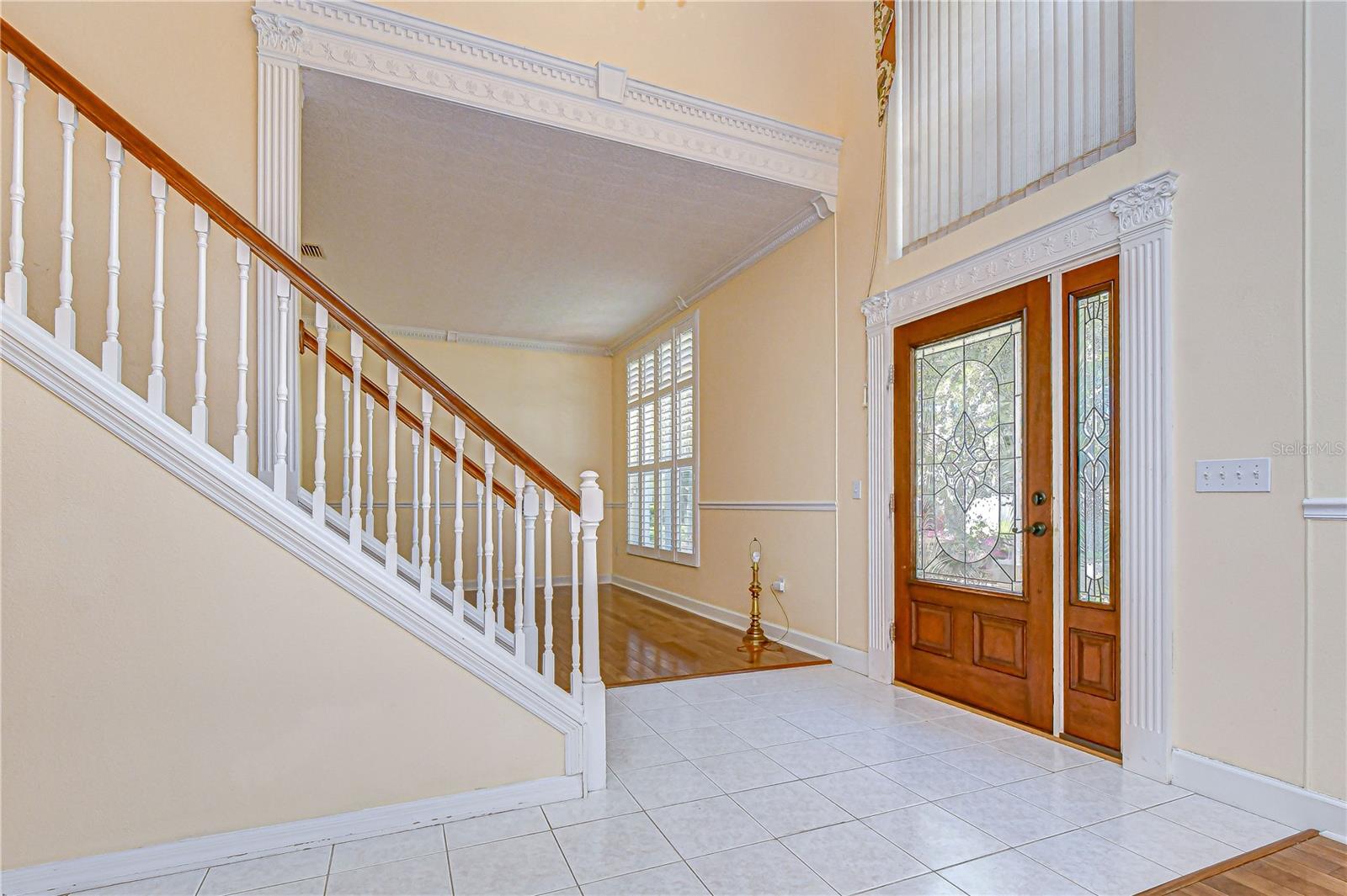 Grand foyer showcases ornate crown molding.