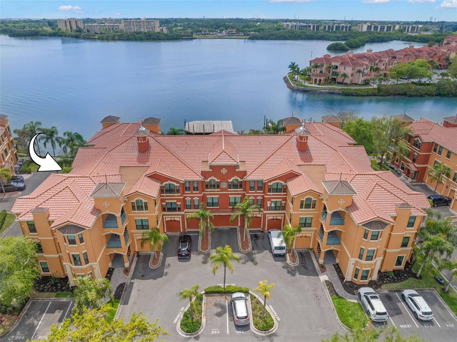 Waterfront living begins here—this 2-bedroom, 2-bath residence is tucked inside the gated Grand Bellagio at Baywatch, surrounded by bay and canal access throughout the community.