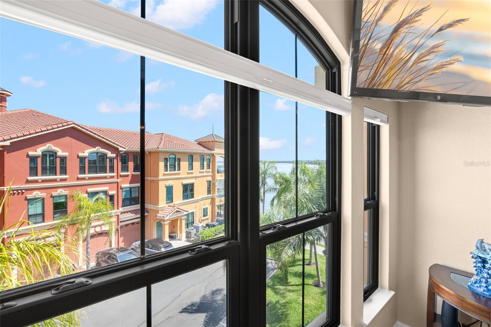 From the living room, enjoy views of the surrounding community with a partial view of Tampa Bay beyond.