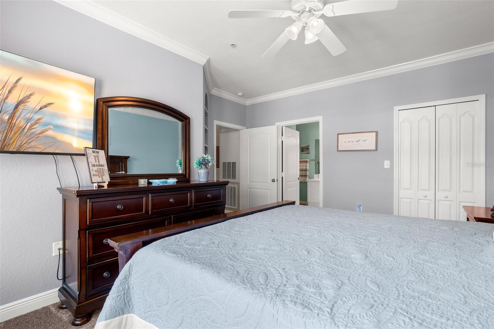 Spacious and well-designed, the primary suite with walk-in closet, connects seamlessly to the en-suite bath, storage areas and walk-in closet.