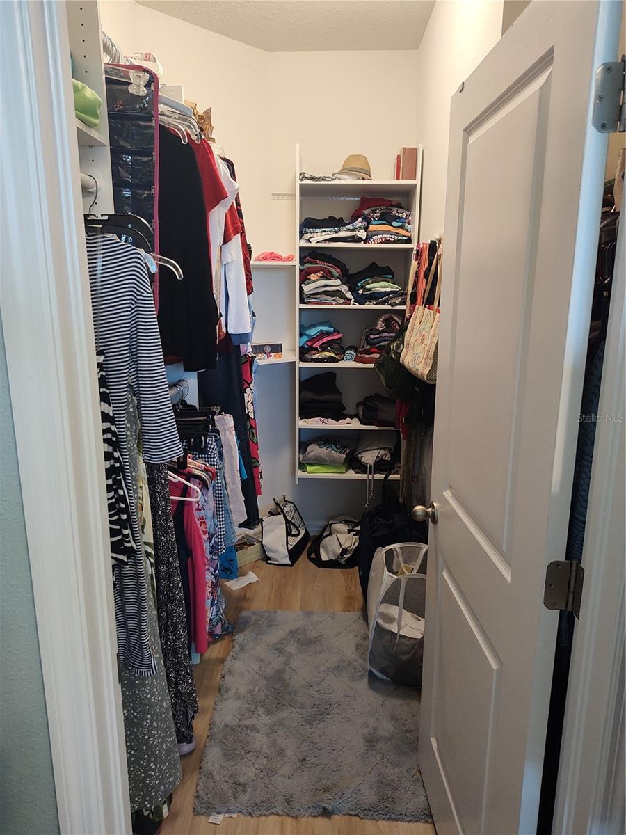 Primar bedroom walk in closet