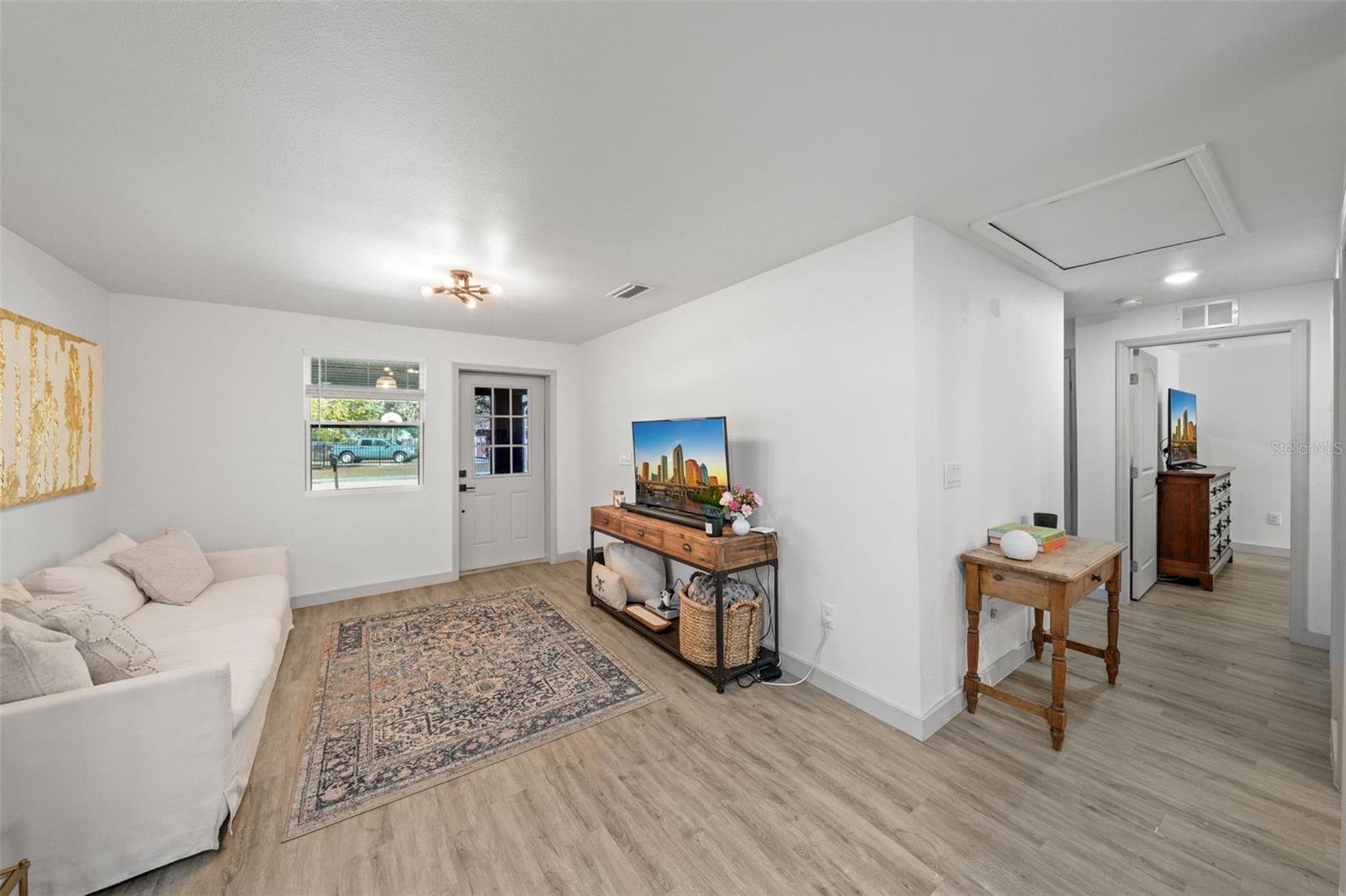 Off living room, find a hall leading to the bedrooms and