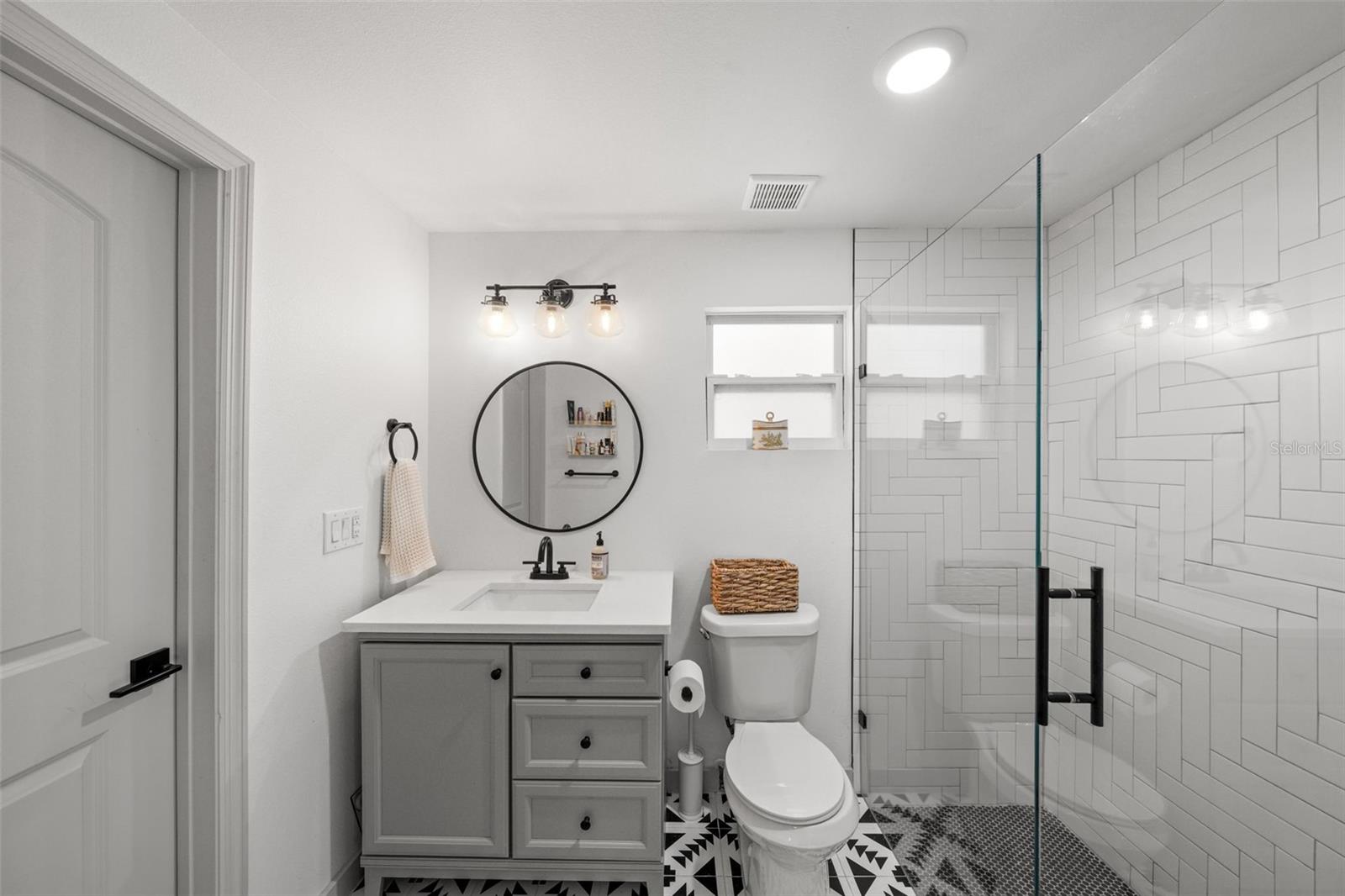 Off the bath is a large walk in closet with shelving system