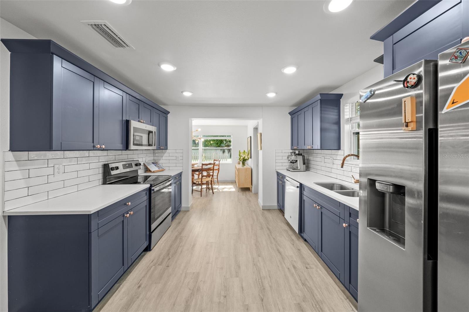 Kitchen leads to dining room