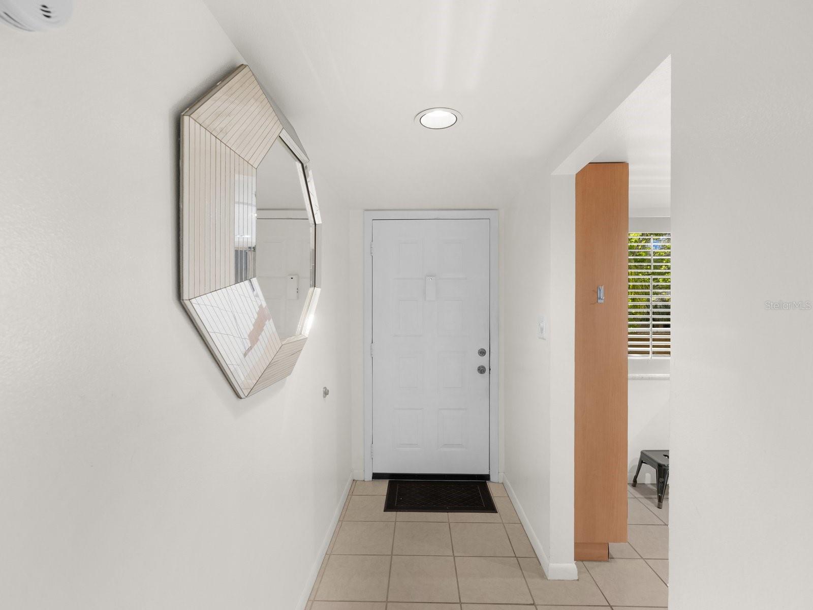 Foyer entry and kitchen on the right