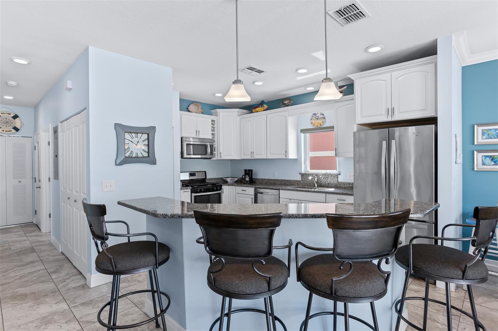 Open concept kitchen, dining and living room