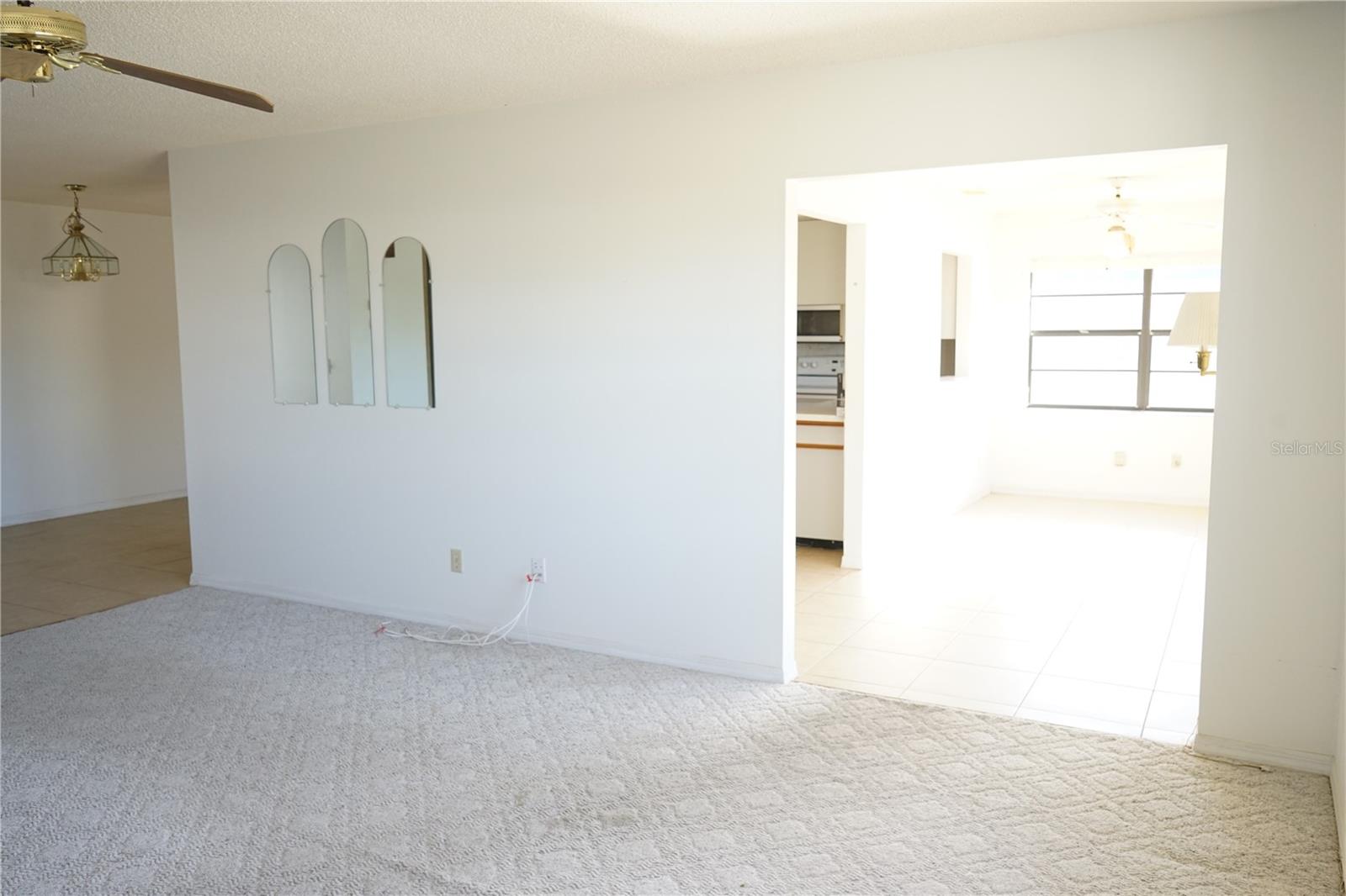 living room with doorway to bonus area