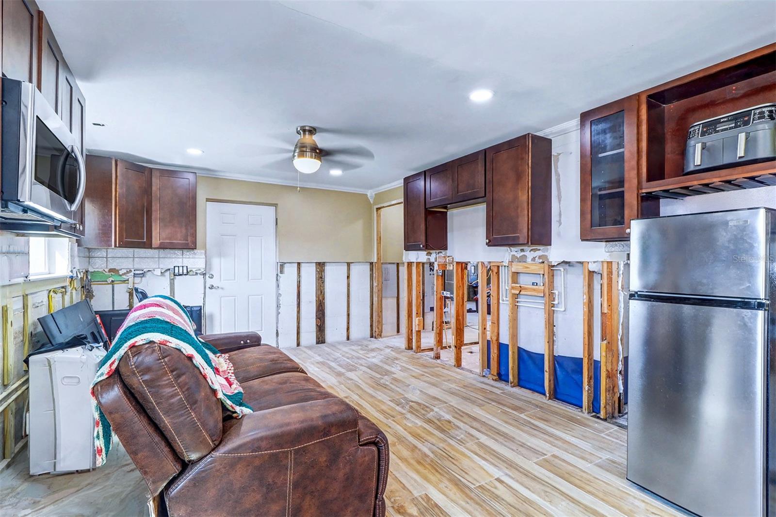 The couch was put there by the son but that is actually part of the kitchen