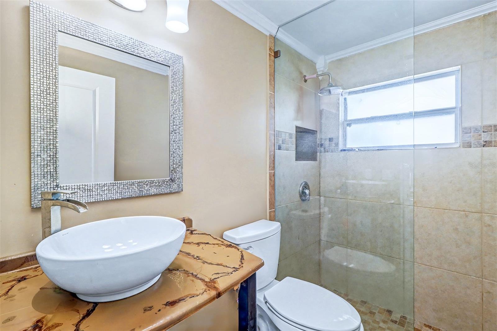 Hall bath is completed and the mirror does not convey