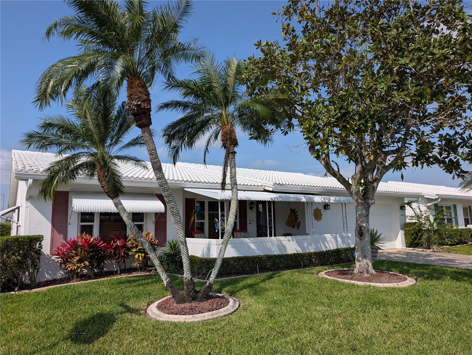 IS THIS YOUR PERFECT FLORIDA HOME?  2BR/2BA/2CG "Philodendron" with a taste of the Tropics on a corner lot located in the Heart of Tampa Bay's +55 Community...Mainlands of Tamarac by the Gulf.