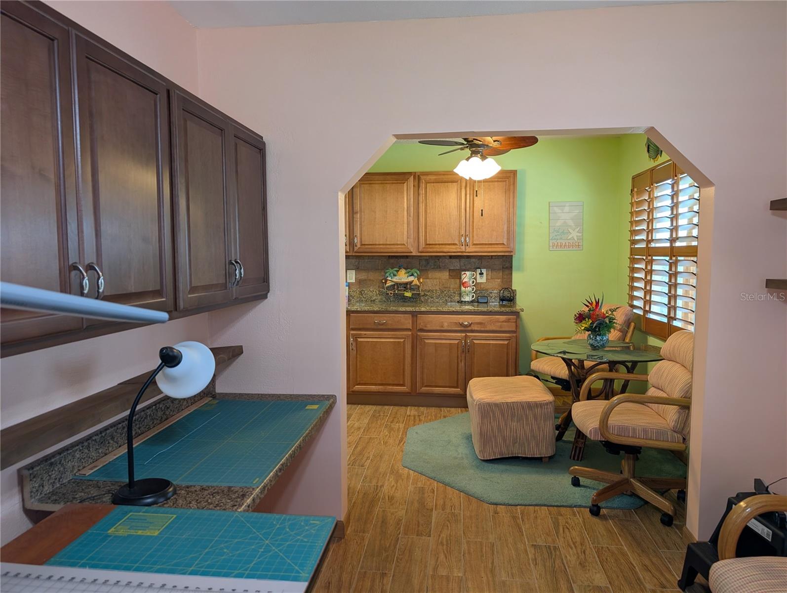 View from Bonus room back to kitchen dinette area.  Kitchen remodel extended the cabinetry providing much more storage space and counterspace.