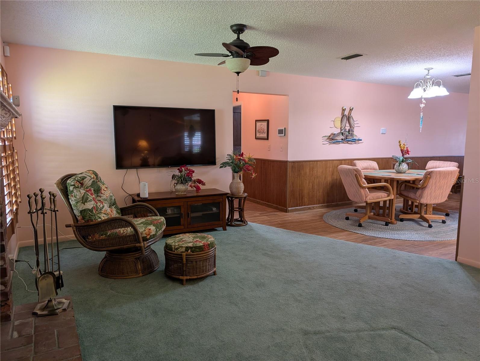View from Florida room to hallway leading to interior laundry and Primary suite.