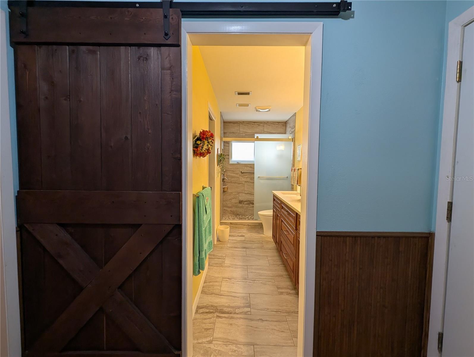 View from laundry into primary bathroom.