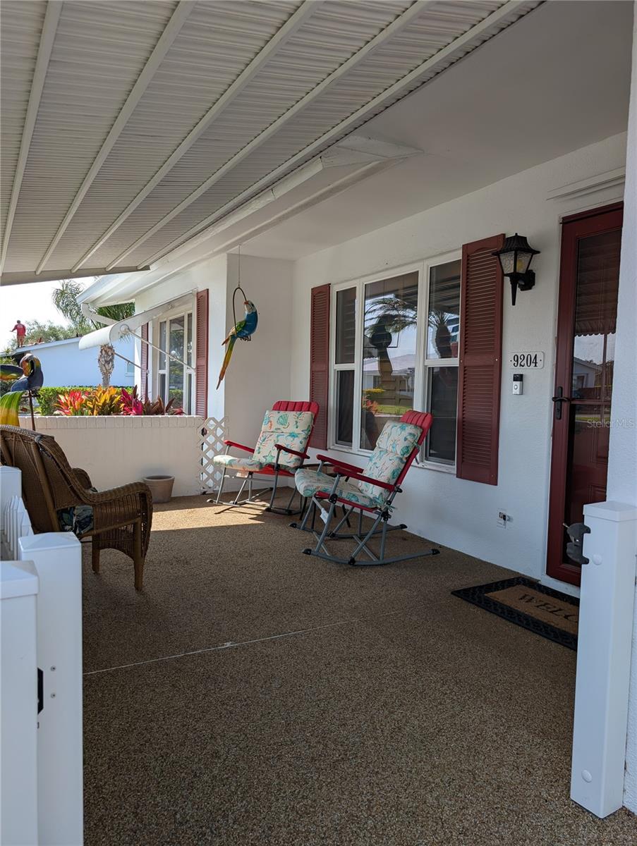 Pet friendly porch has a gate so your furry friends can sit outside with you. Windows are impact installed 2009. Ring doorbell (under address).