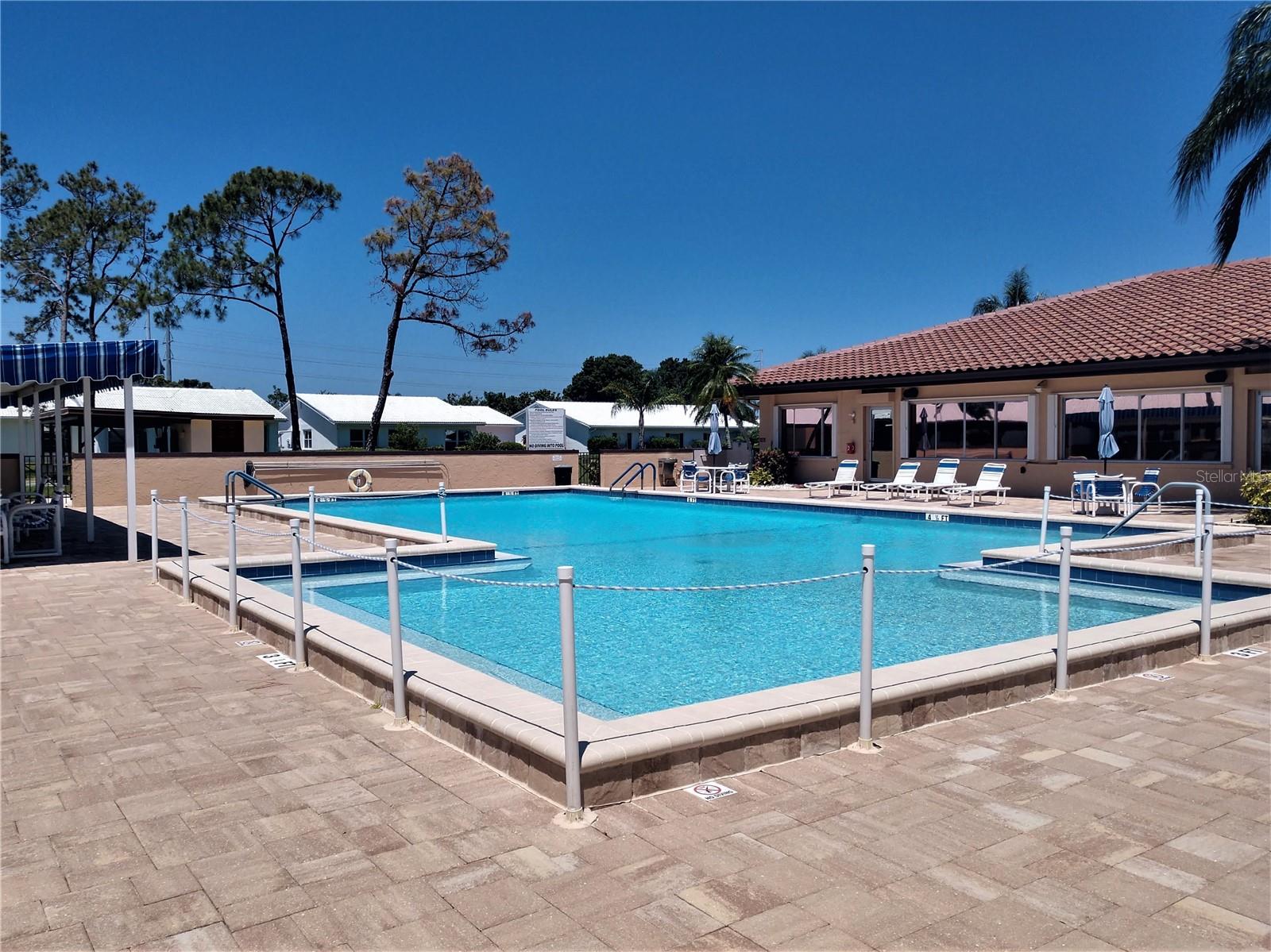 Beautiful crystal-clear, heated community pool for relaxing, exercising, cooling off or just socializing.  Lounge chairs, shower and bathroom access for residents convenience.