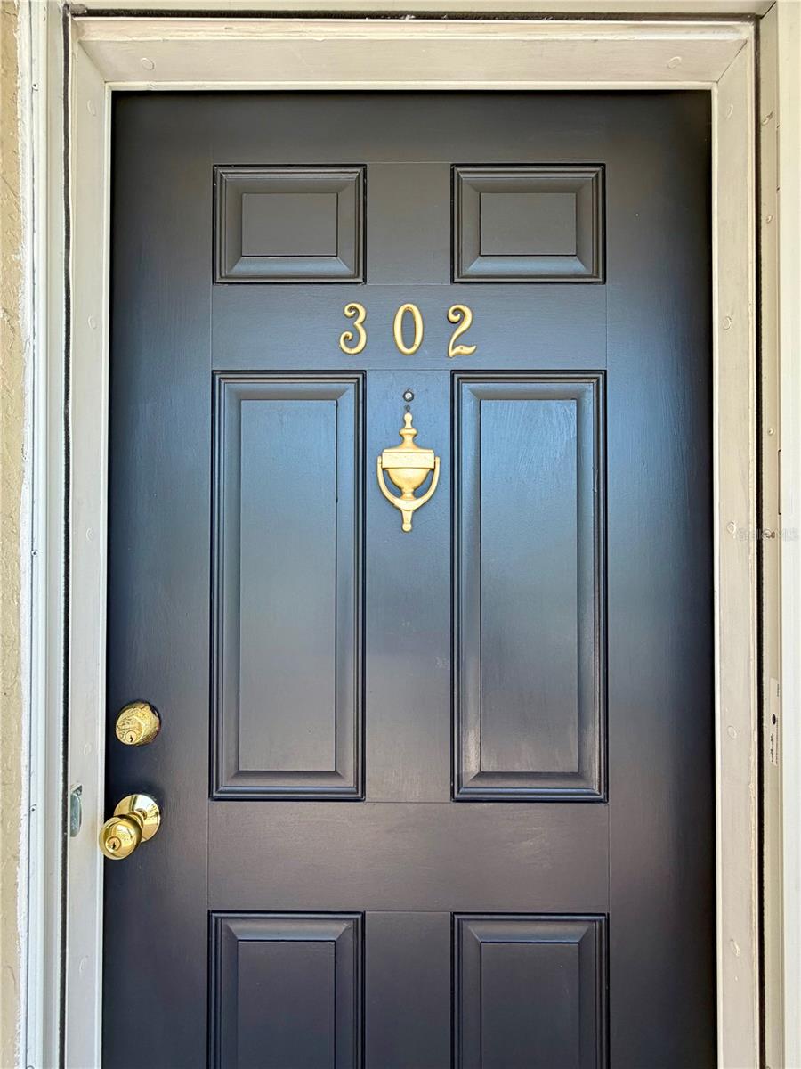 Number 302, complete with freshly painted front door.