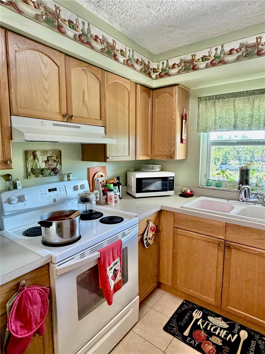 Kitchen with solid wood cabinets.