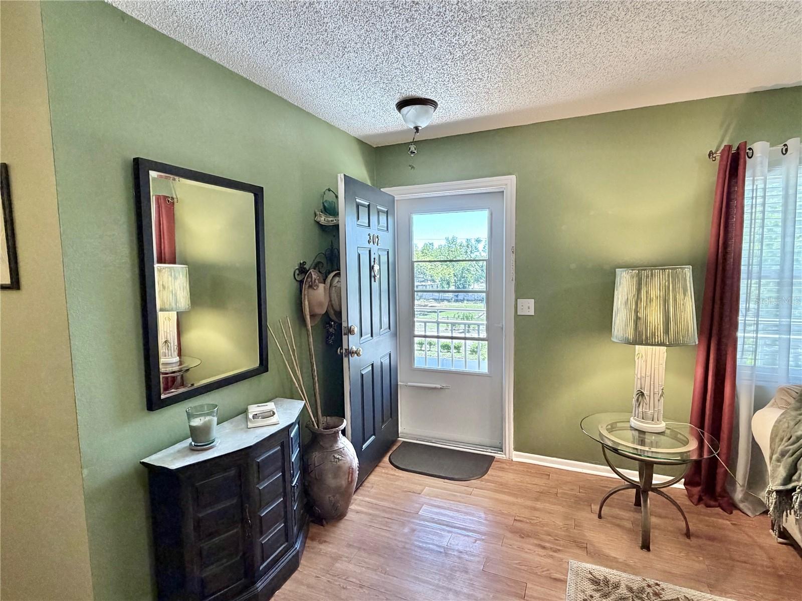 Looking toward the front door from the spacious living room.