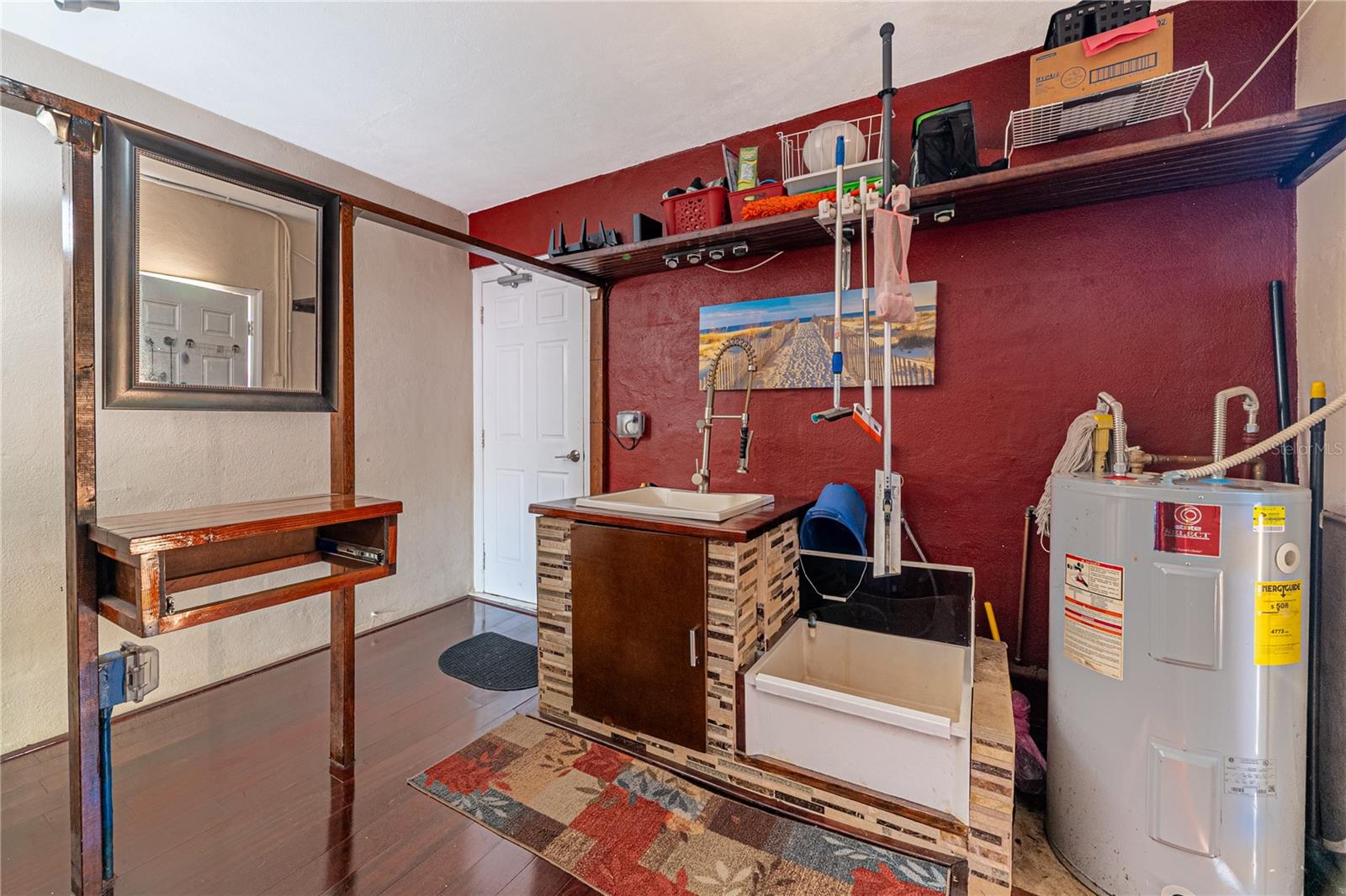 Laundry room with sink and table