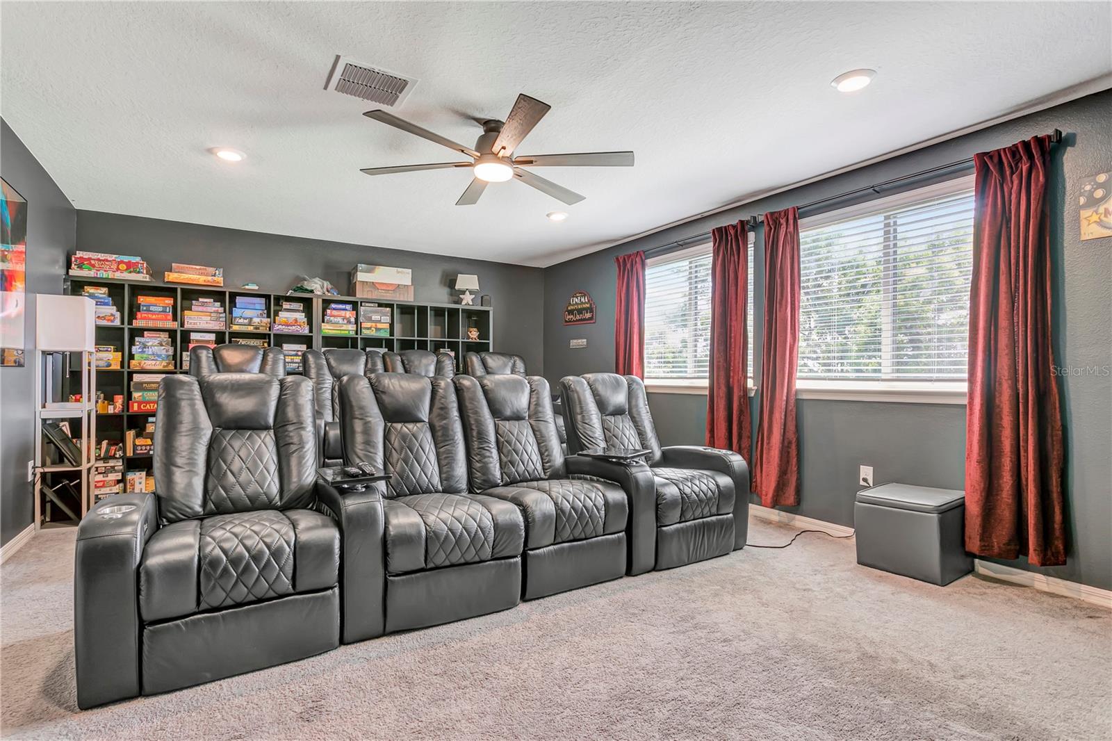 Tiered-floor theater room: The ultimate upstairs retreat for game days and movie marathons.