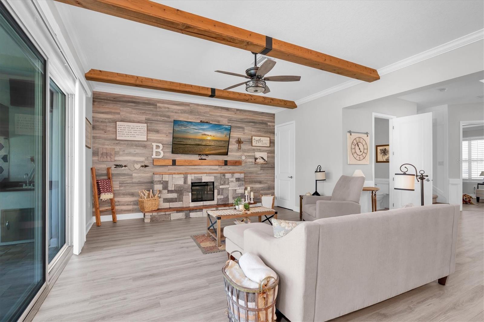 LIVING ROOM WITH ACCENT WALL & FIREPLACE