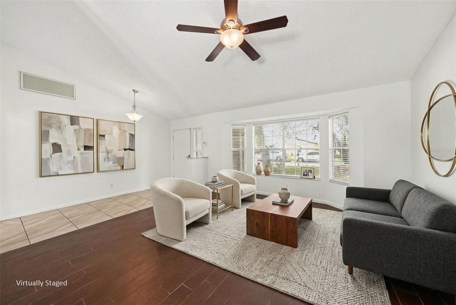 Bay window is enjoyed in your living room. Virtually Staged.