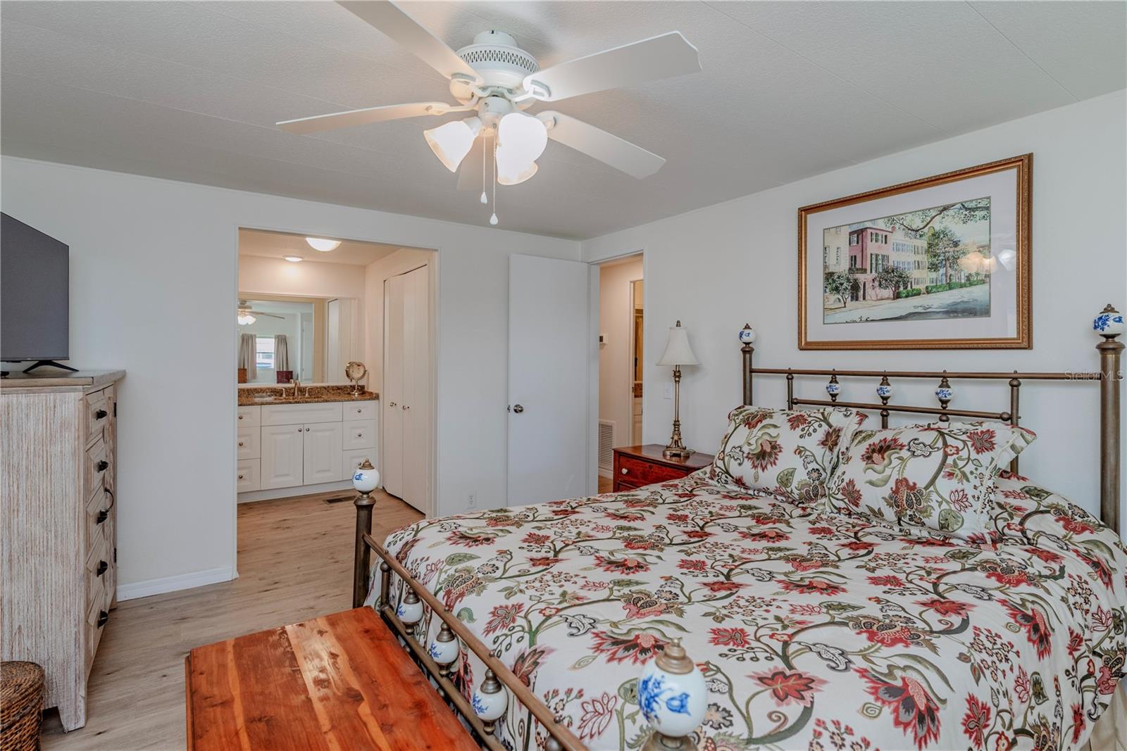 Primary bedroom with ensuite bath and walk-in closet.