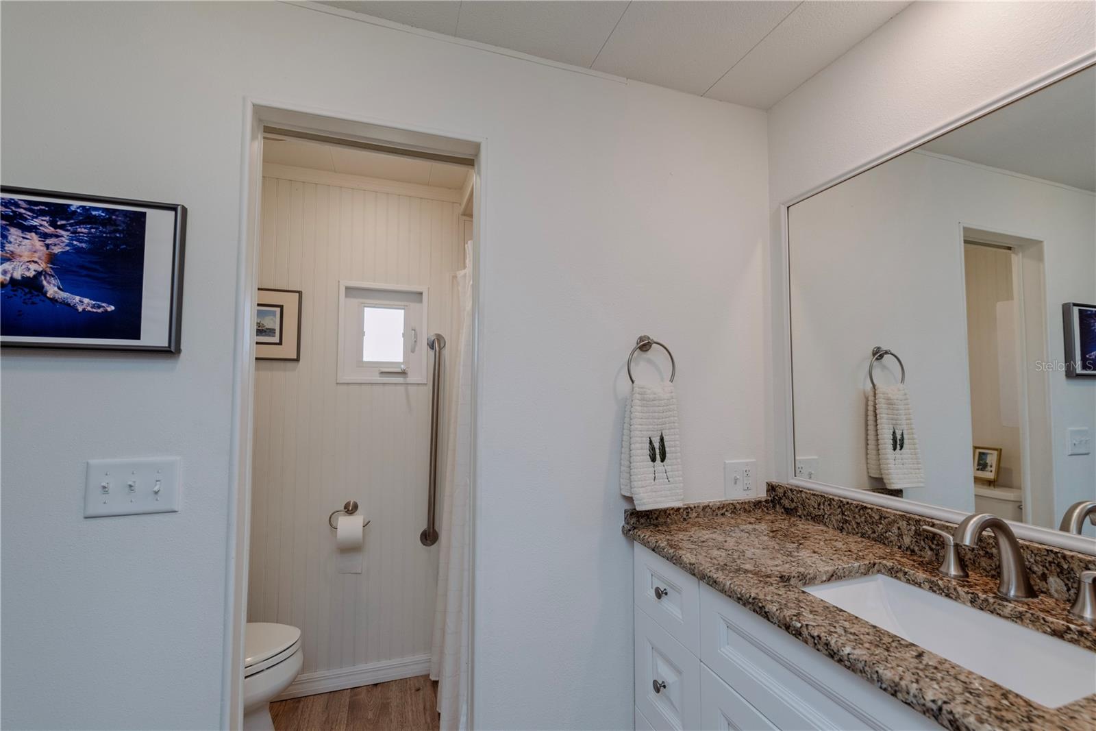 Primary bathroom with separate shower area.