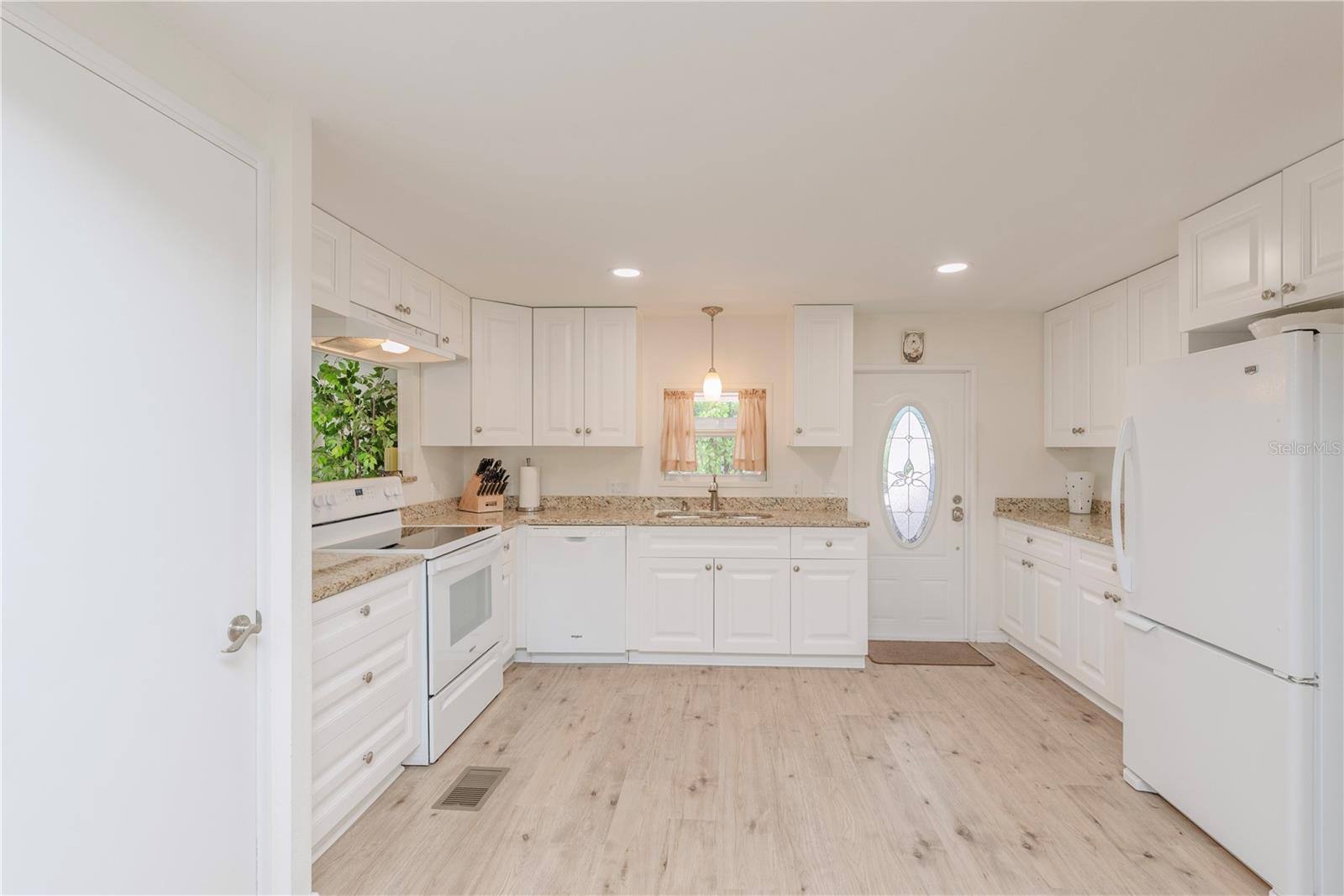 Kitchen has coffee bar.